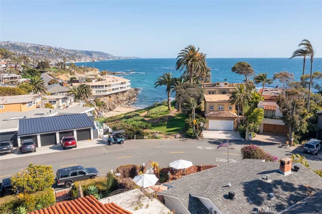 856 Cliff Drive Laguna Beach, CA 92651 - Photo 25 of 28 an aerial view of a house with a swimming pool and outdoor seating
