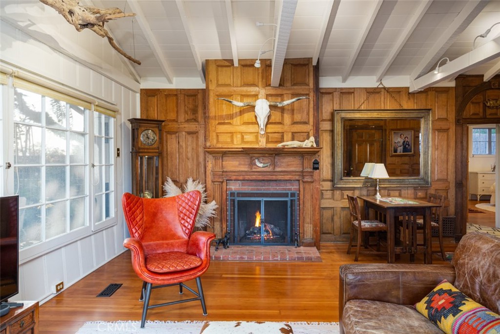 856 Cliff Drive Laguna Beach, CA 92651 - Photo 8 of 28 a living room with patio furniture and a fireplace