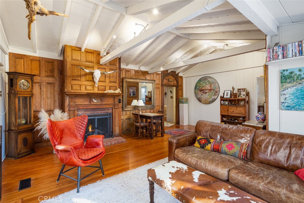 856 Cliff Drive Laguna Beach, CA 92651 - Photo 10 of 28 a living room with furniture and a clock