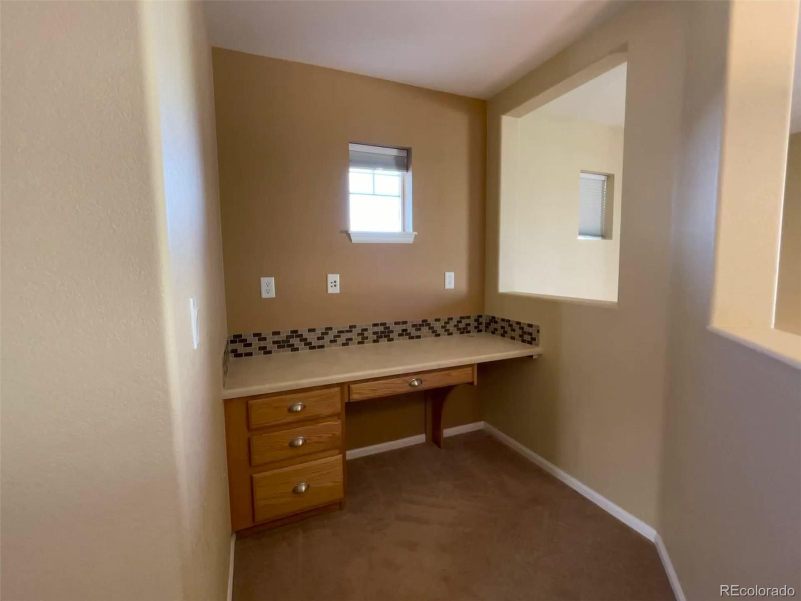 10838 Towerbridge Road Highlands Ranch, CO 80130 - Photo 11 of 26 a room with a sink and a mirror