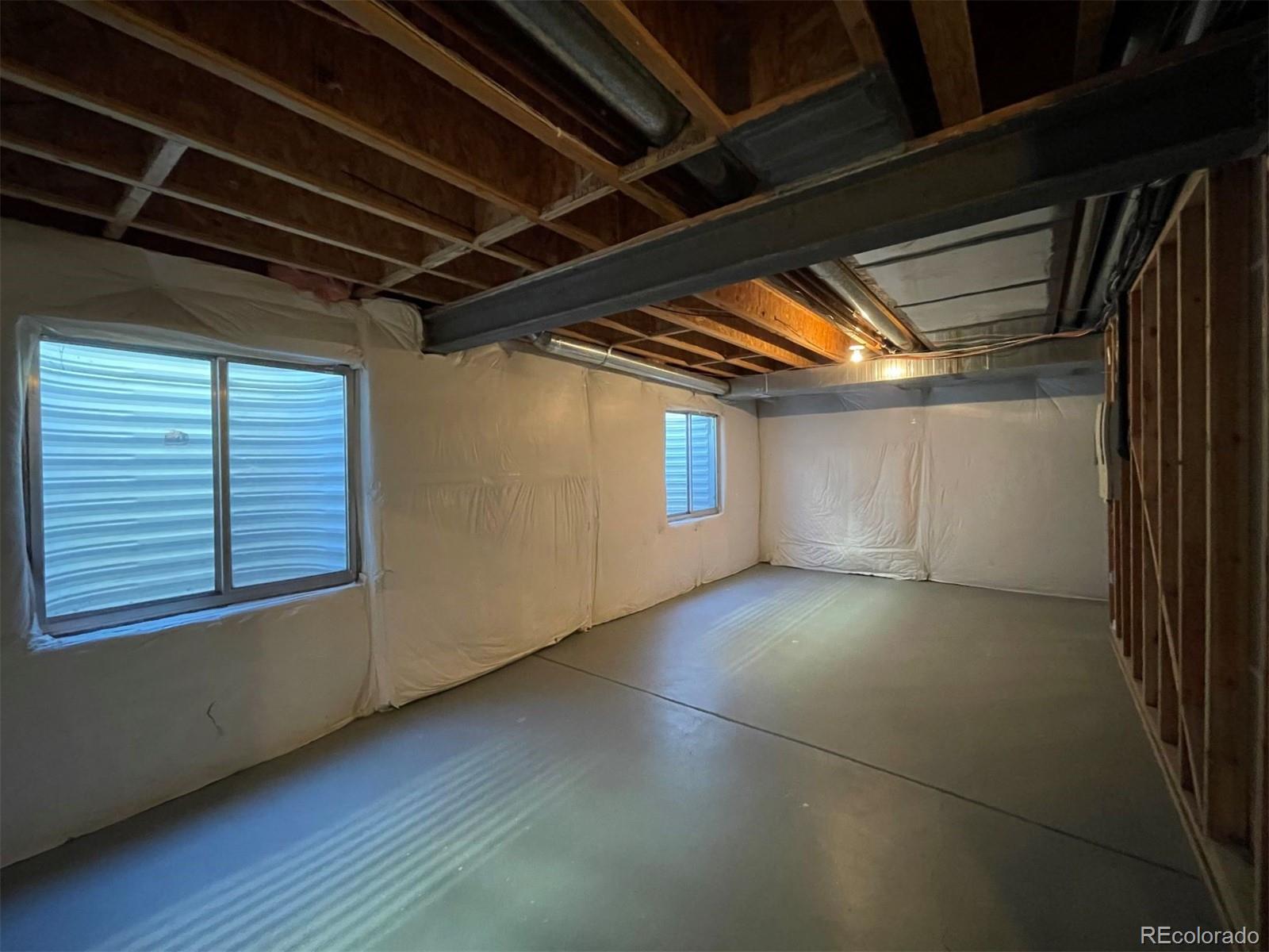 10838 Towerbridge Road Highlands Ranch, CO 80130 - Photo 20 of 26 a view of a room with wooden walls