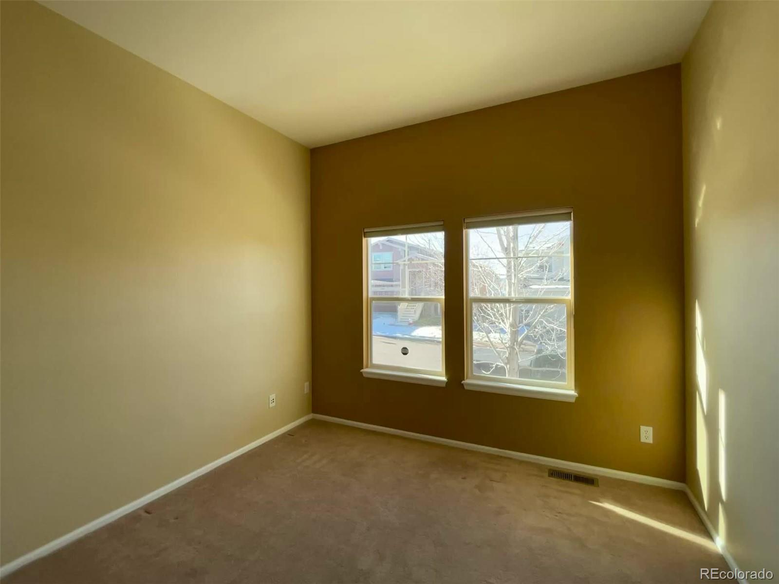 10838 Towerbridge Road Highlands Ranch, CO 80130 - Photo 6 of 26 a view of an empty room with a window