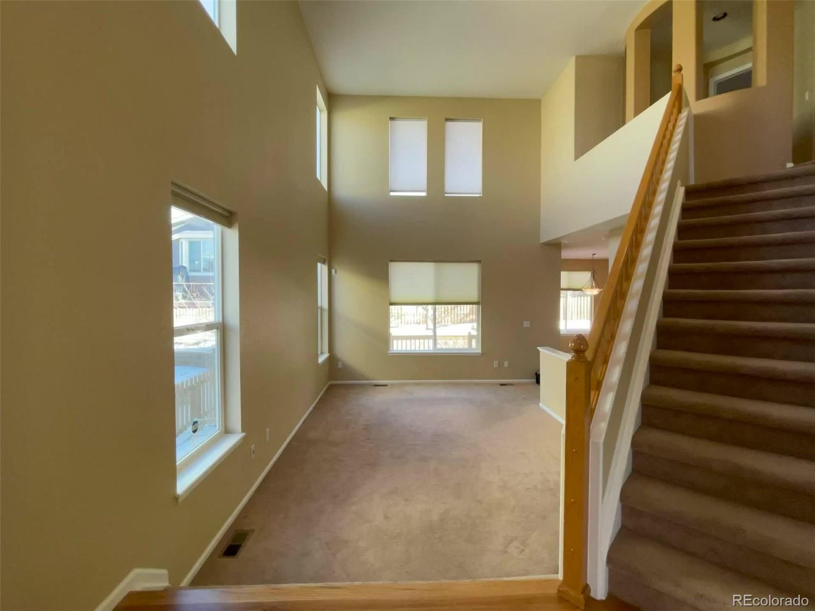 10838 Towerbridge Road Highlands Ranch, CO 80130 - Photo 9 of 26 a view of an entryway with staircase