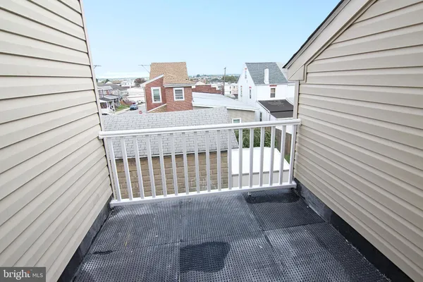 a view of a balcony with furniture