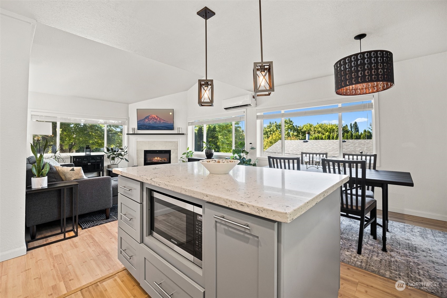 7222 16th Avenue Southwest Seattle, WA 98106 - Photo 14 of 31 a kitchen with stainless steel appliances granite countertop a stove and a wooden floors