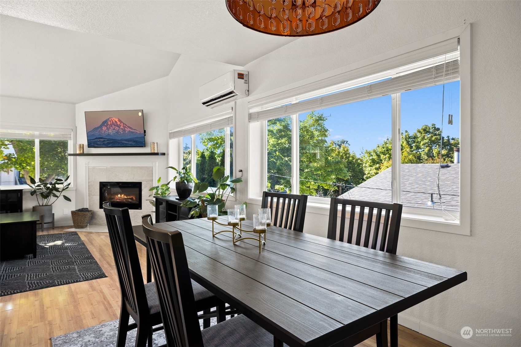 7222 16th Avenue Southwest Seattle, WA 98106 - Photo 16 of 31 a view of a dining room with furniture window and wooden floor