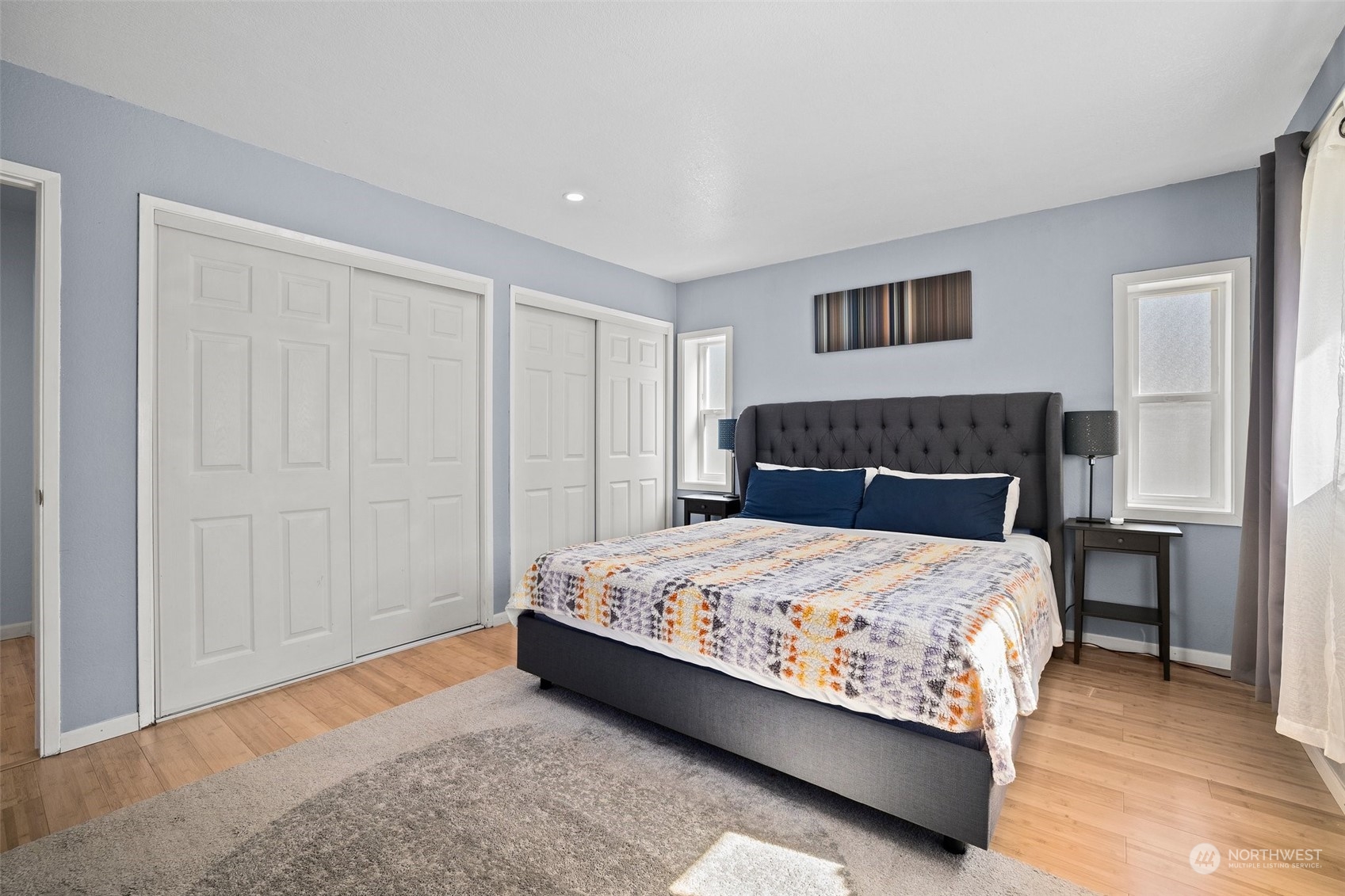 7222 16th Avenue Southwest Seattle, WA 98106 - Photo 19 of 31 a bedroom with a bed and a dresser