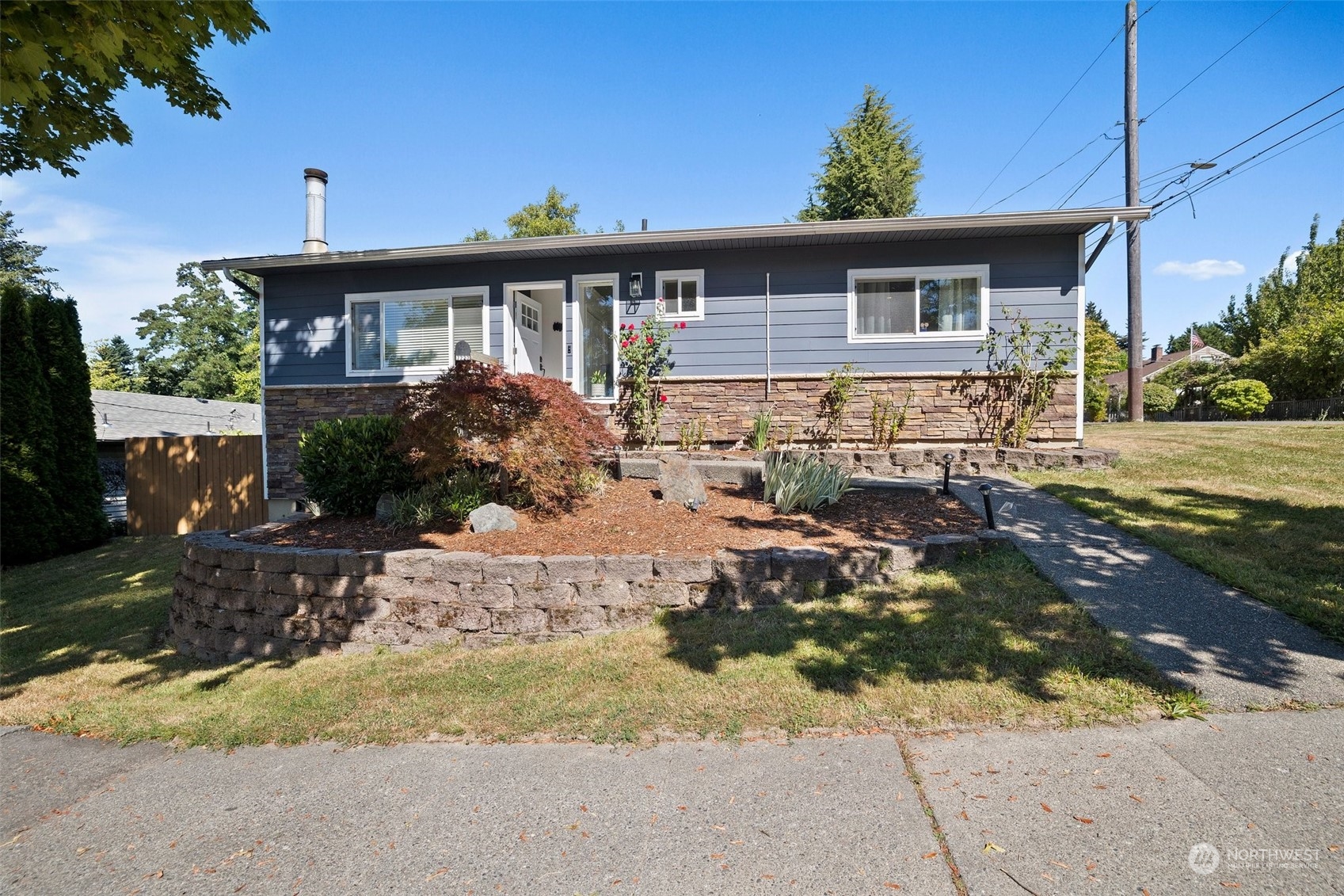 7222 16th Avenue Southwest Seattle, WA 98106 - Photo 2 of 31 a front view of a house with a yard