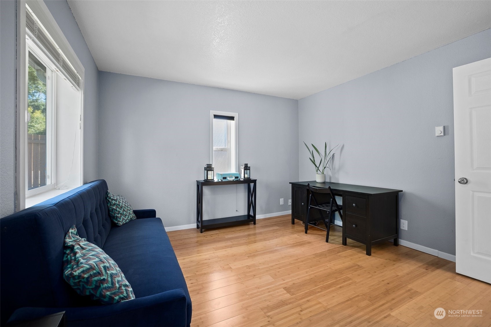 7222 16th Avenue Southwest Seattle, WA 98106 - Photo 22 of 31 a living room with furniture and a window