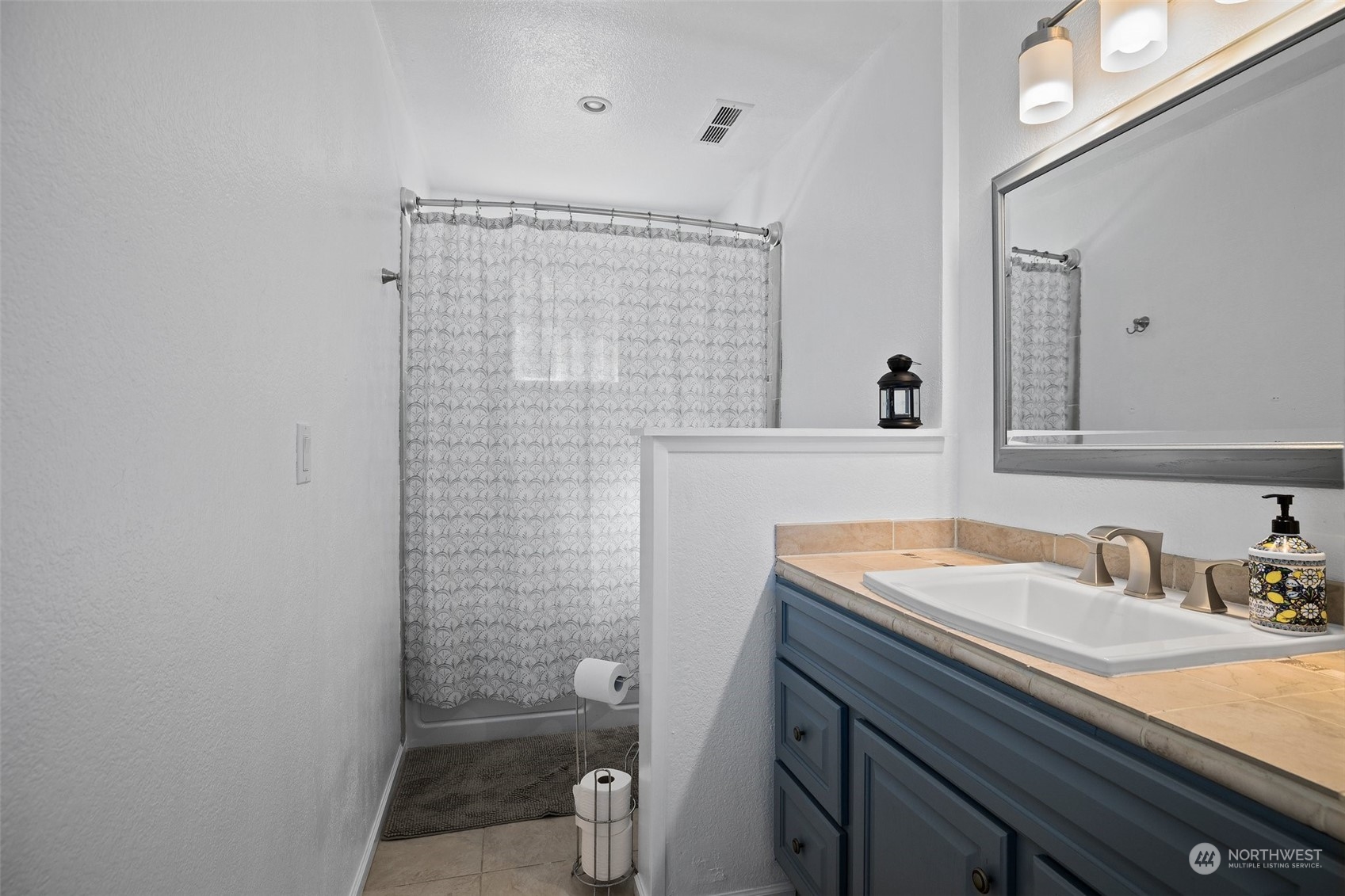 7222 16th Avenue Southwest Seattle, WA 98106 - Photo 24 of 31 a bathroom with a sink a toilet and shower