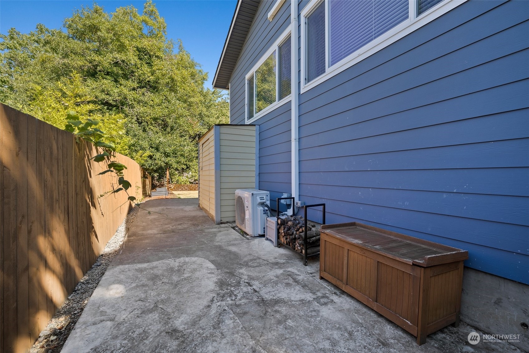 7222 16th Avenue Southwest Seattle, WA 98106 - Photo 29 of 31 a view of a backyard with chairs and wooden fence