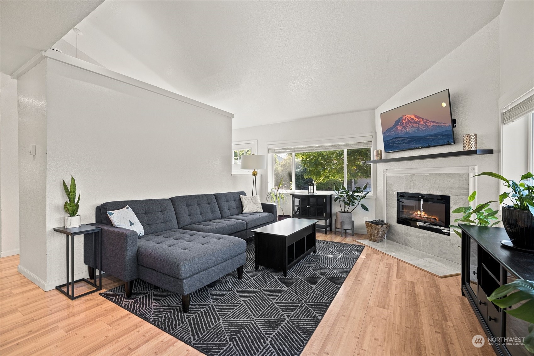 7222 16th Avenue Southwest Seattle, WA 98106 - Photo 4 of 31 a living room with furniture and a fireplace