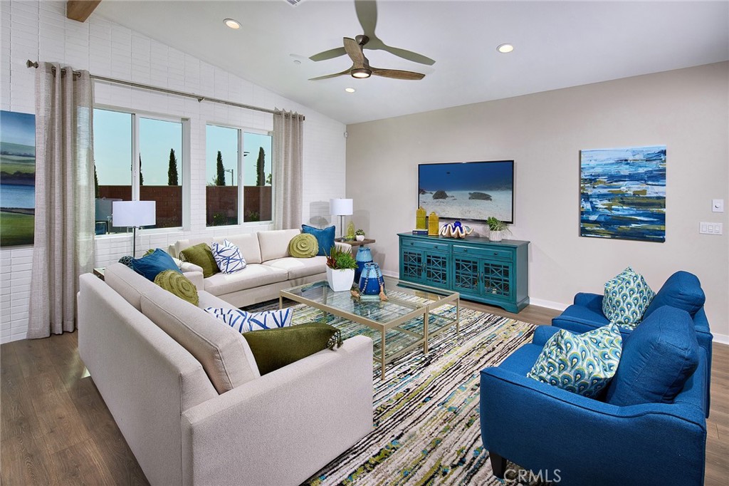 30934 Campania Road Highland, CA 92346 - Photo 2 of 19 a living room with furniture and a flat screen tv