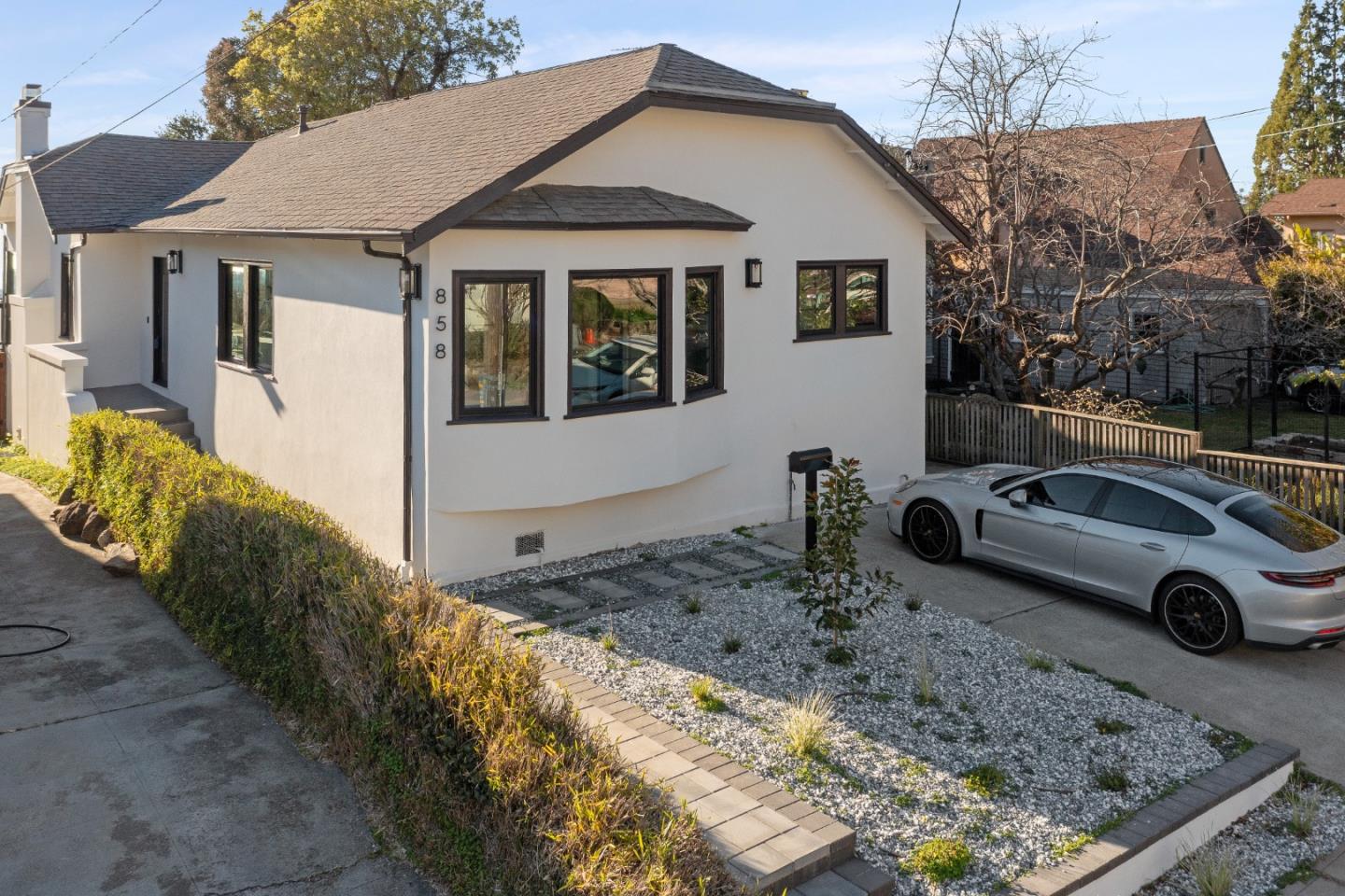 a front view of a house with parking area