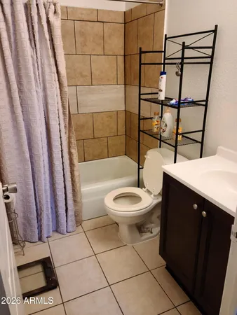 a bathroom with a toilet a sink and bathtub