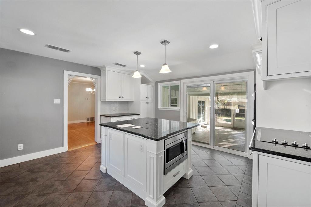 1512 Cardinal Road Mansfield, TX 76063 - Photo 14 of 37 a kitchen with granite countertop a stove and a sink