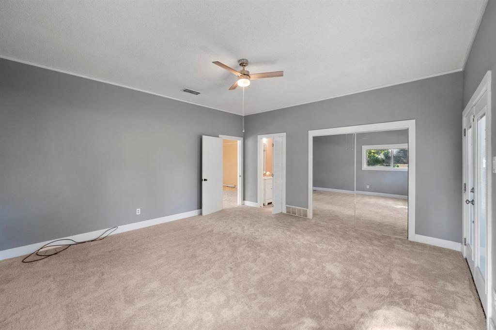 1512 Cardinal Road Mansfield, TX 76063 - Photo 17 of 37 an empty room with closet and a ceiling fan