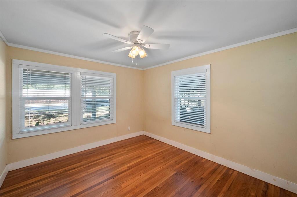 1512 Cardinal Road Mansfield, TX 76063 - Photo 19 of 37 a view of an empty room with wooden floor and a window