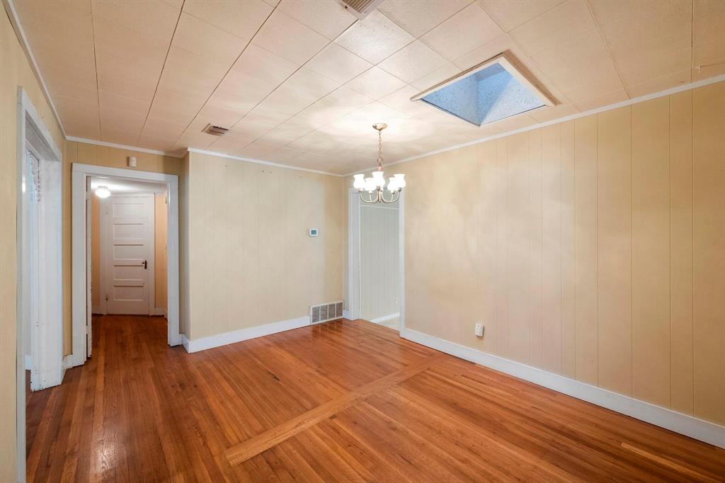 1512 Cardinal Road Mansfield, TX 76063 - Photo 8 of 37 a view of a room with wooden floor and a ceiling fan