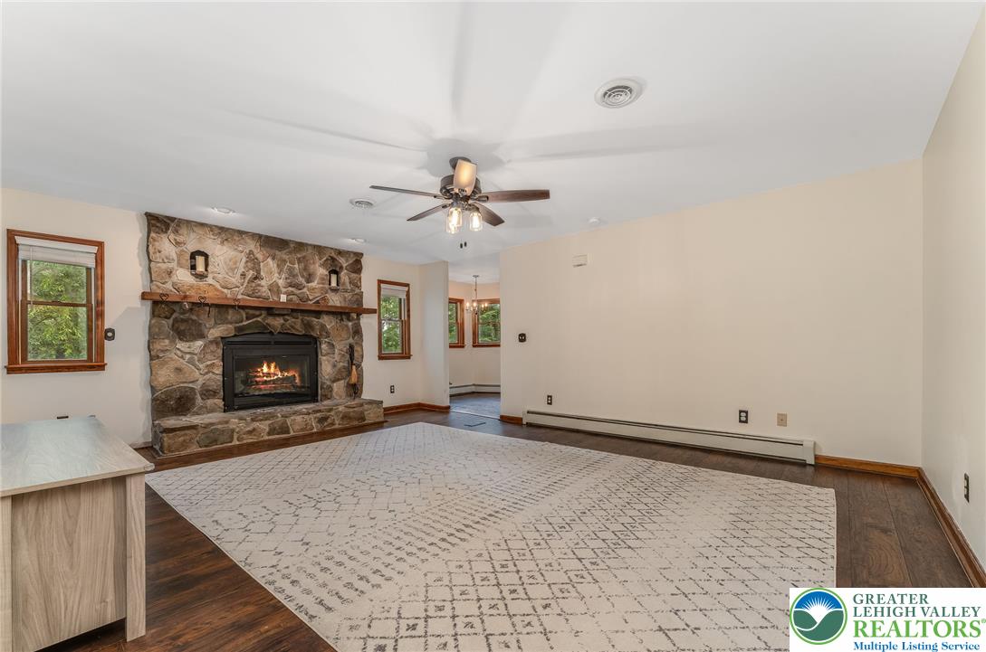 465 Raubsville Road Easton, PA 18042 - Photo 28 of 60 A striking stone fireplace hearth anchors this living area.