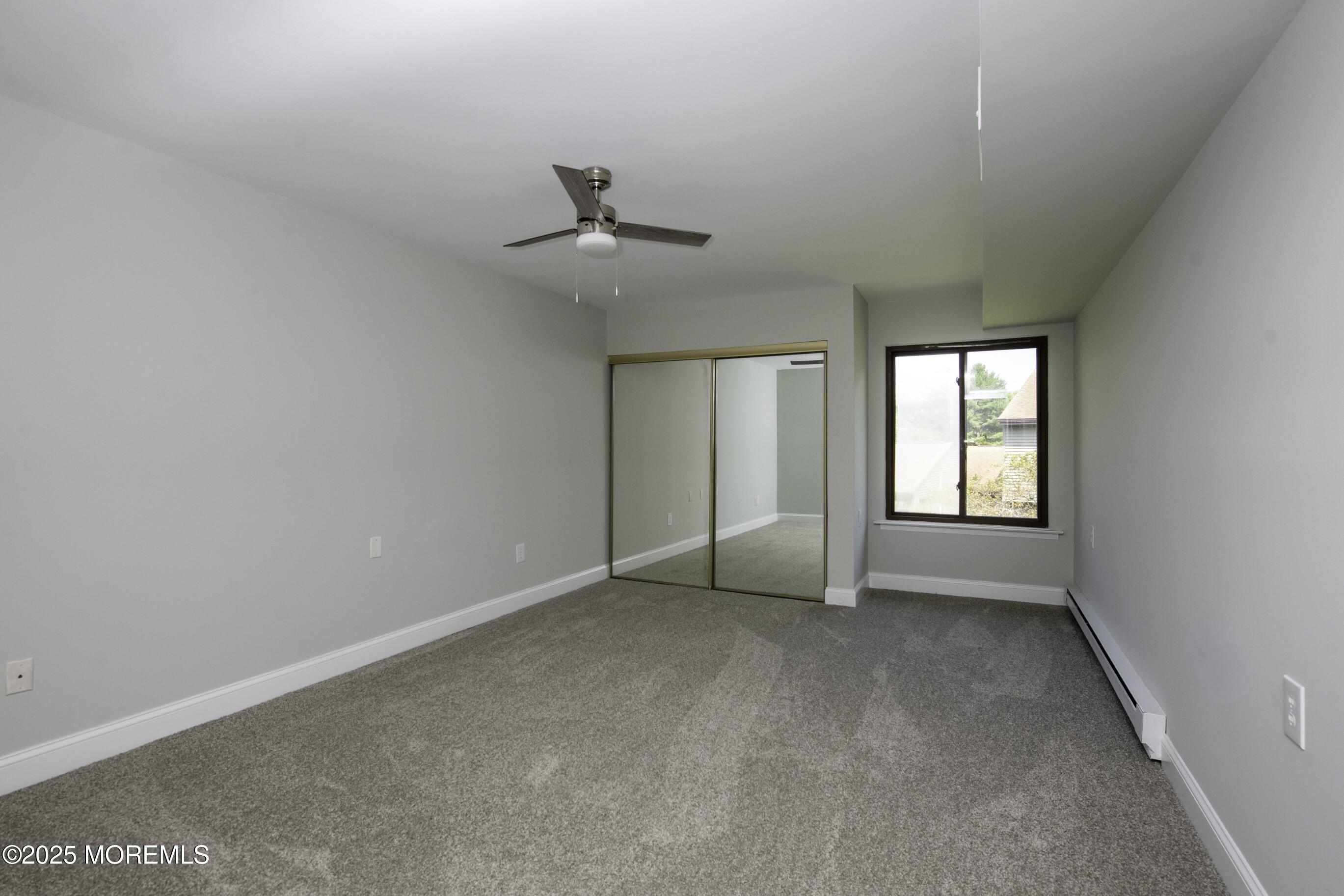 5 B Auburn Court Red Bank, NJ 07701 - Photo 11 of 19 a view of an empty room with a window