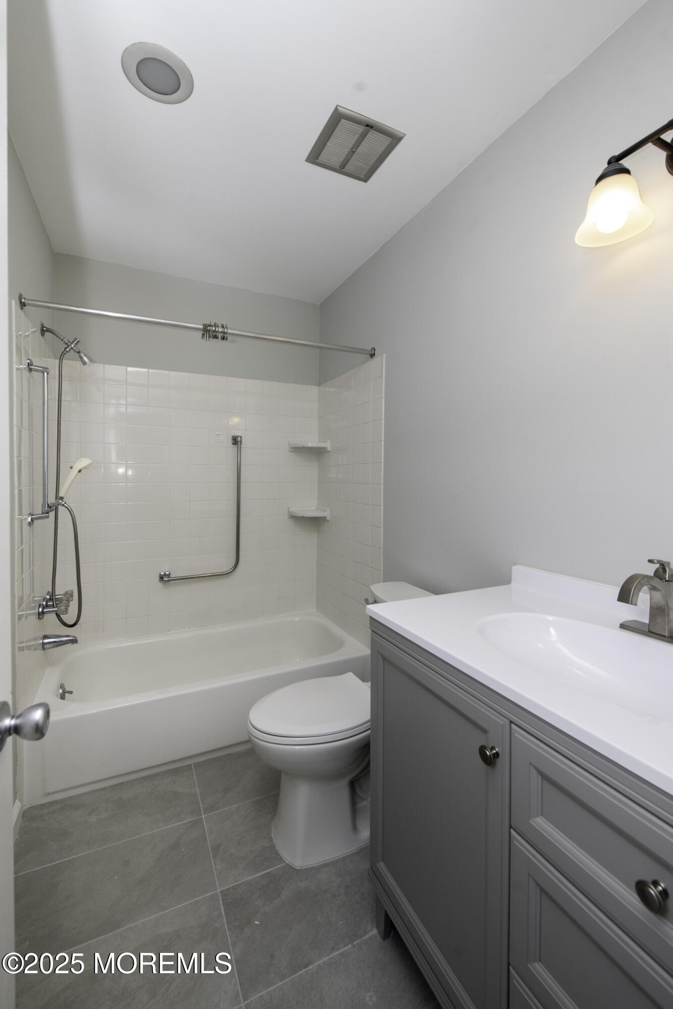 5 B Auburn Court Red Bank, NJ 07701 - Photo 16 of 19 a bathroom with a sink a toilet and a shower
