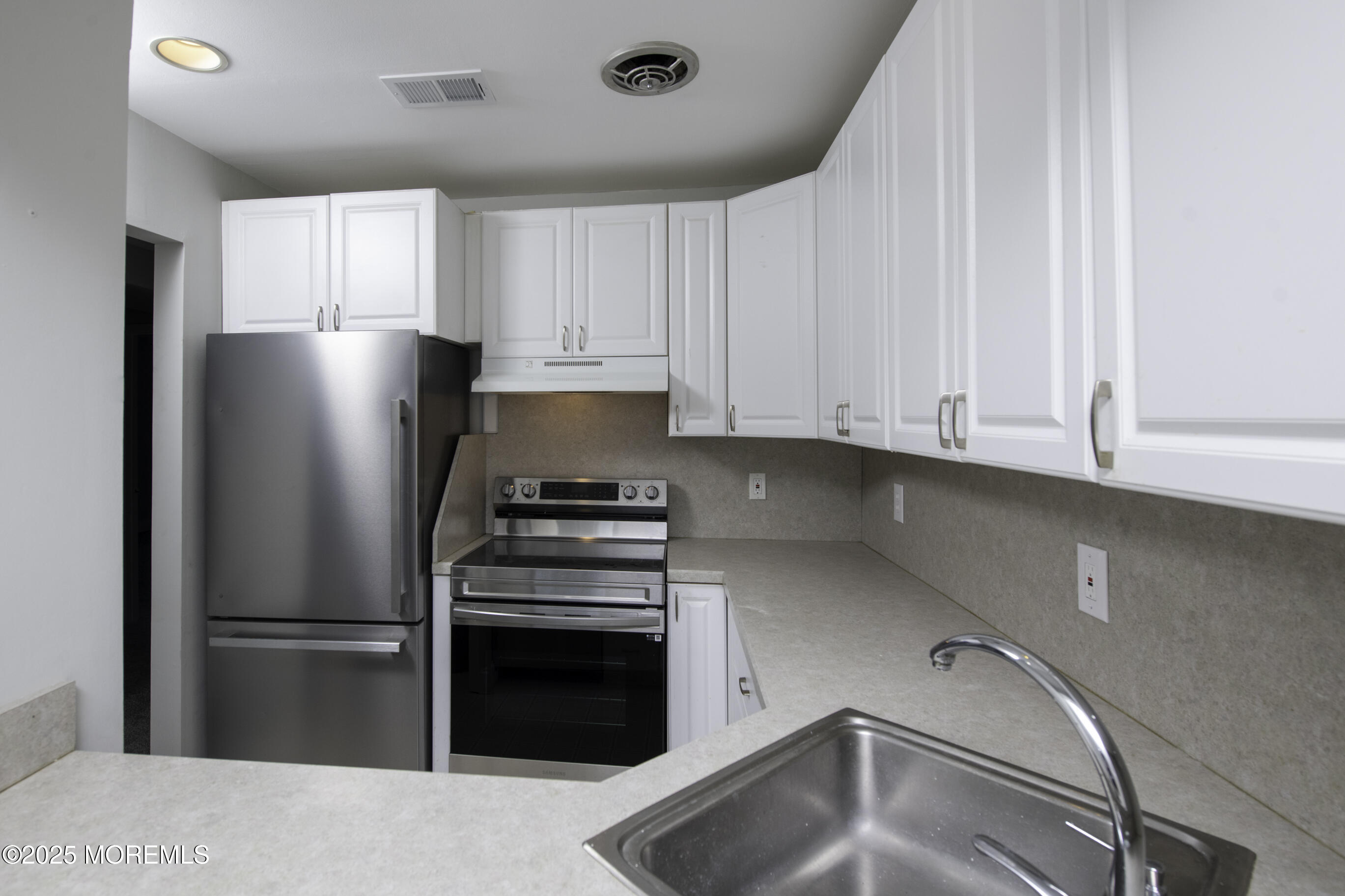 5 B Auburn Court Red Bank, NJ 07701 - Photo 18 of 19 a kitchen with a refrigerator and a sink