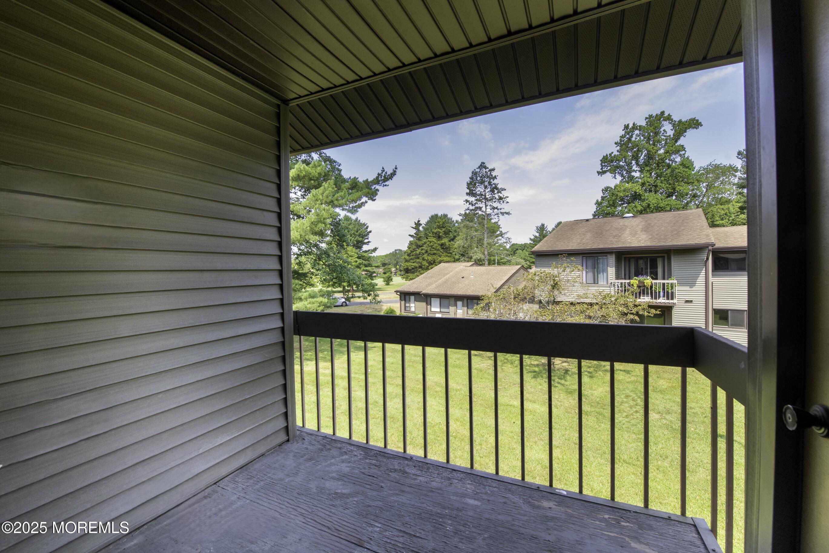 5 B Auburn Court Red Bank, NJ 07701 - Photo 2 of 19 a view of a porch with a table and chairs