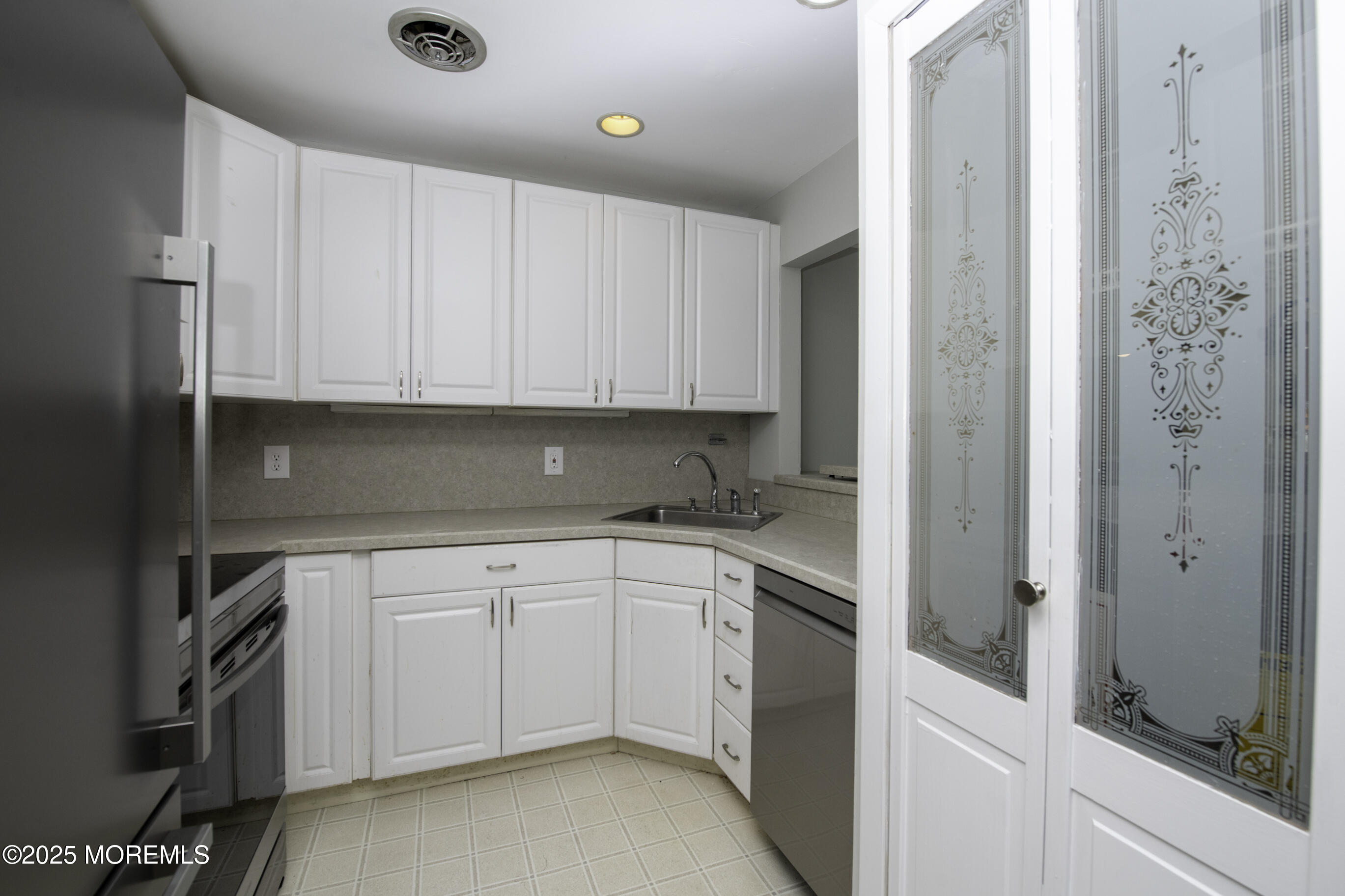 5 B Auburn Court Red Bank, NJ 07701 - Photo 9 of 19 a kitchen with a sink and cabinets