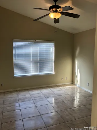 a view of a room with a ceiling fan and a chandelier fan