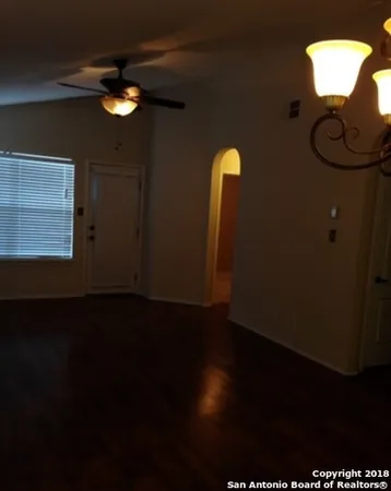 a view of a workspace with wooden floor