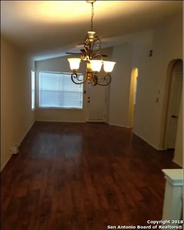 a view of kitchen and hall with wooden floor
