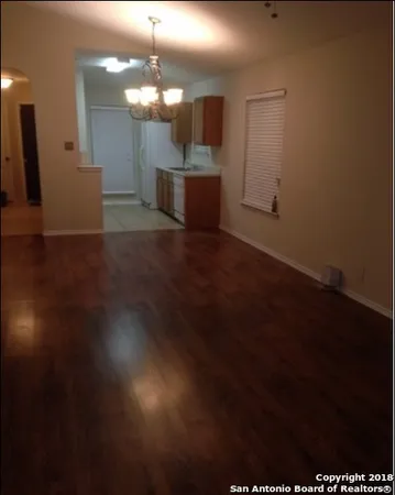 a view of a livingroom with furniture and a window