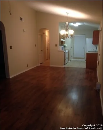 a kitchen with granite countertop a sink and cabinets