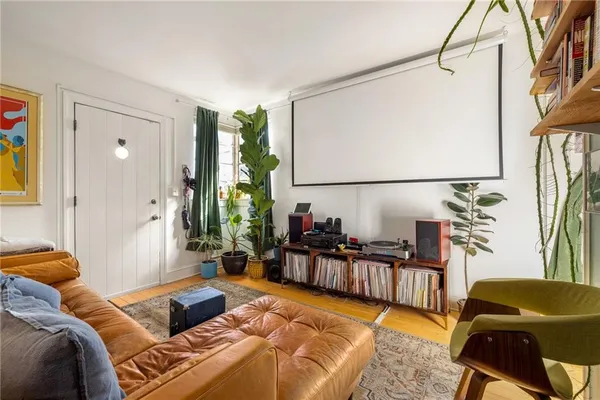 a bedroom with furniture and a window
