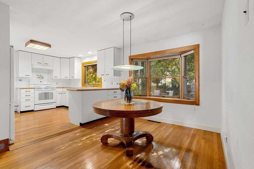 9 Pearson Street Beverly, MA 01915 - Photo 11 of 41 a living room with kitchen view and a wooden floor