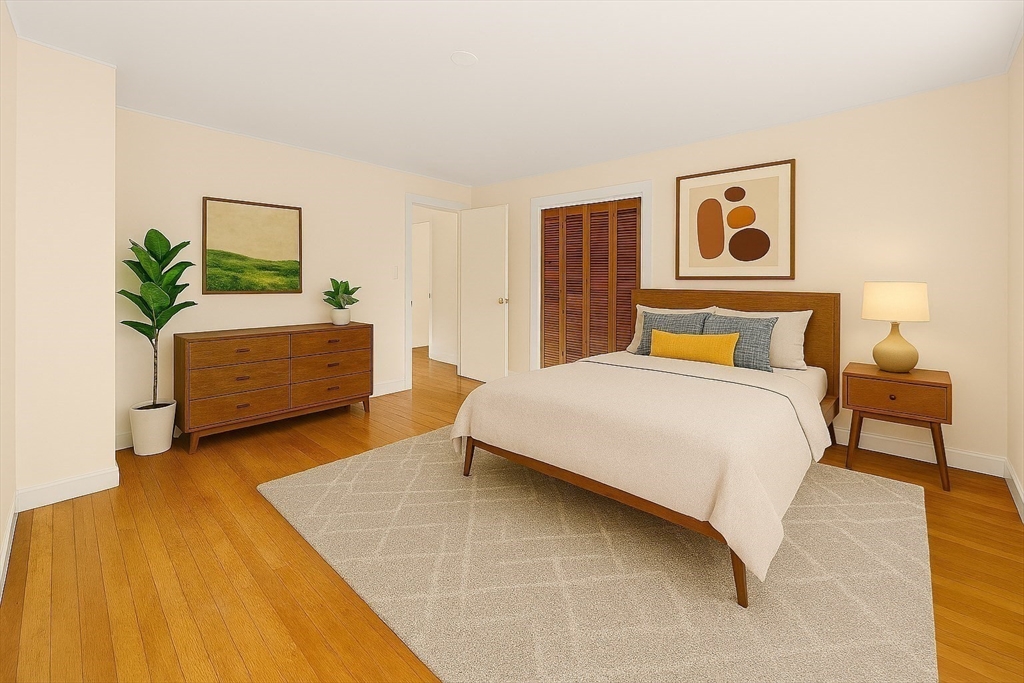 9 Pearson Street Beverly, MA 01915 - Photo 13 of 41 a bedroom with a bed and a couch