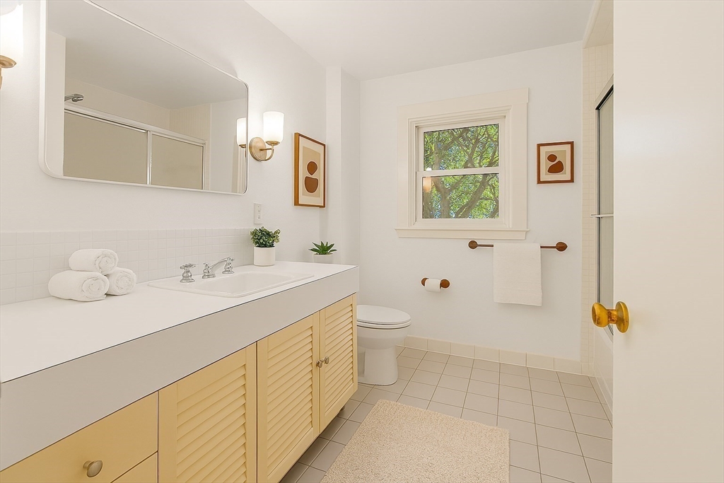 9 Pearson Street Beverly, MA 01915 - Photo 15 of 41 a bathroom with a sink a toilet and shower