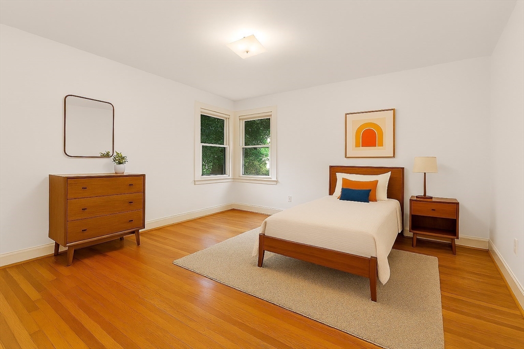 9 Pearson Street Beverly, MA 01915 - Photo 16 of 41 a bedroom with a bed and wooden floor