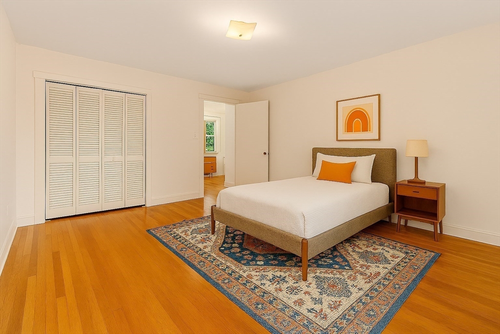 9 Pearson Street Beverly, MA 01915 - Photo 18 of 41 a bedroom with a bed and wooden floor