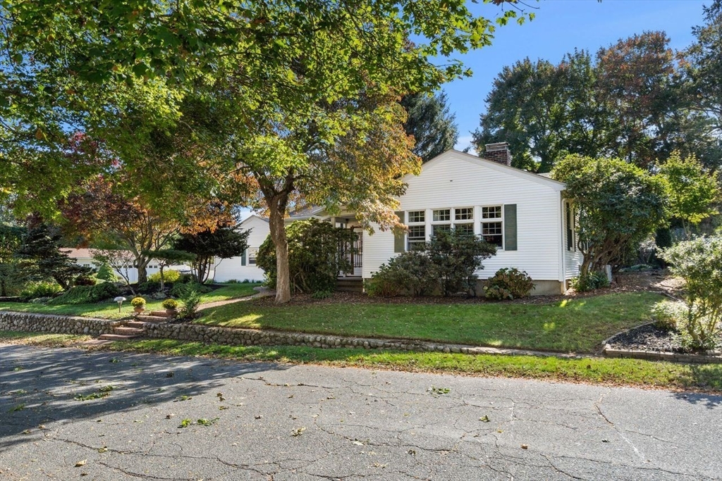 9 Pearson Street Beverly, MA 01915 - Photo 2 of 41 a front view of a house with a yard and road