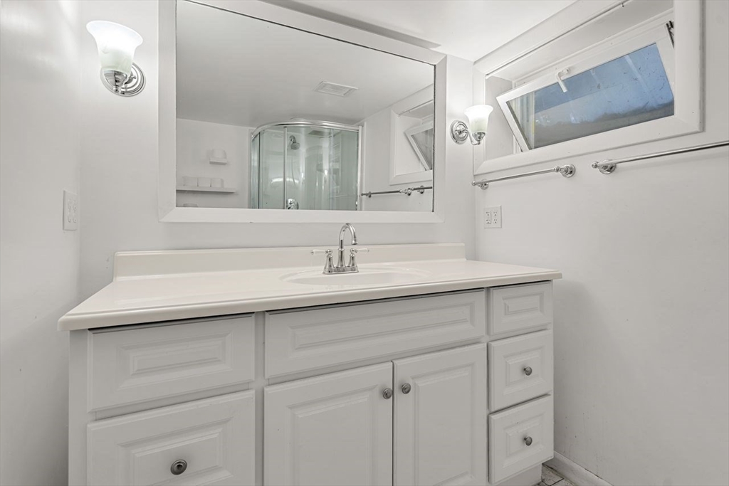 9 Pearson Street Beverly, MA 01915 - Photo 27 of 41 a bathroom with a sink and a mirror