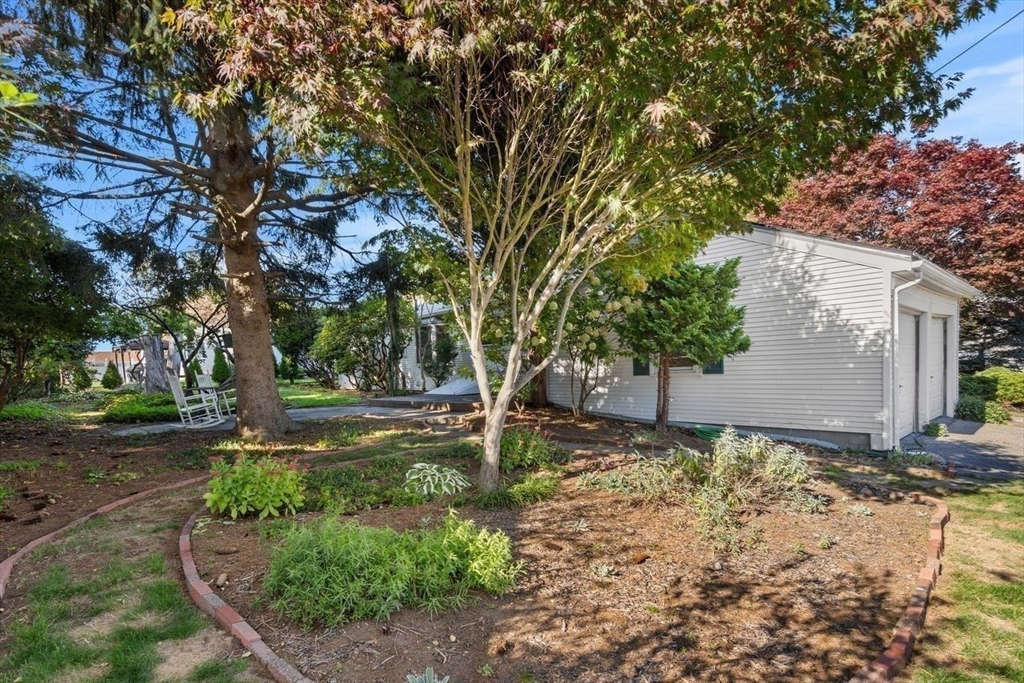 9 Pearson Street Beverly, MA 01915 - Photo 33 of 41 a backyard of a house with lots of green space