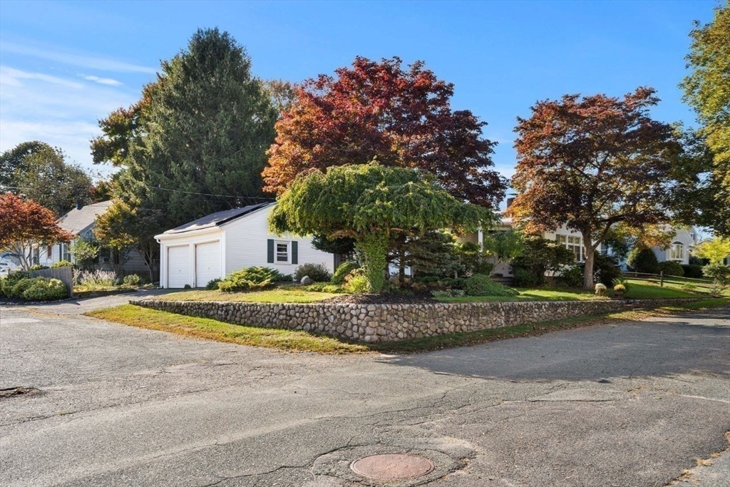 9 Pearson Street Beverly, MA 01915 - Photo 39 of 41 a front view of a house with a yard and garage