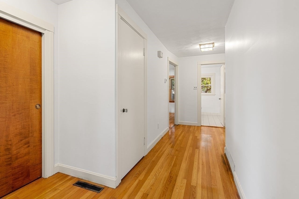 9 Pearson Street Beverly, MA 01915 - Photo 5 of 41 a view of a hallway with wooden floor