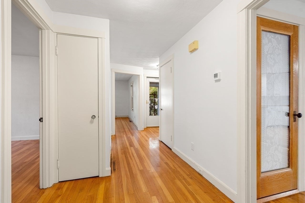 9 Pearson Street Beverly, MA 01915 - Photo 6 of 41 a view of a hallway with wooden floor