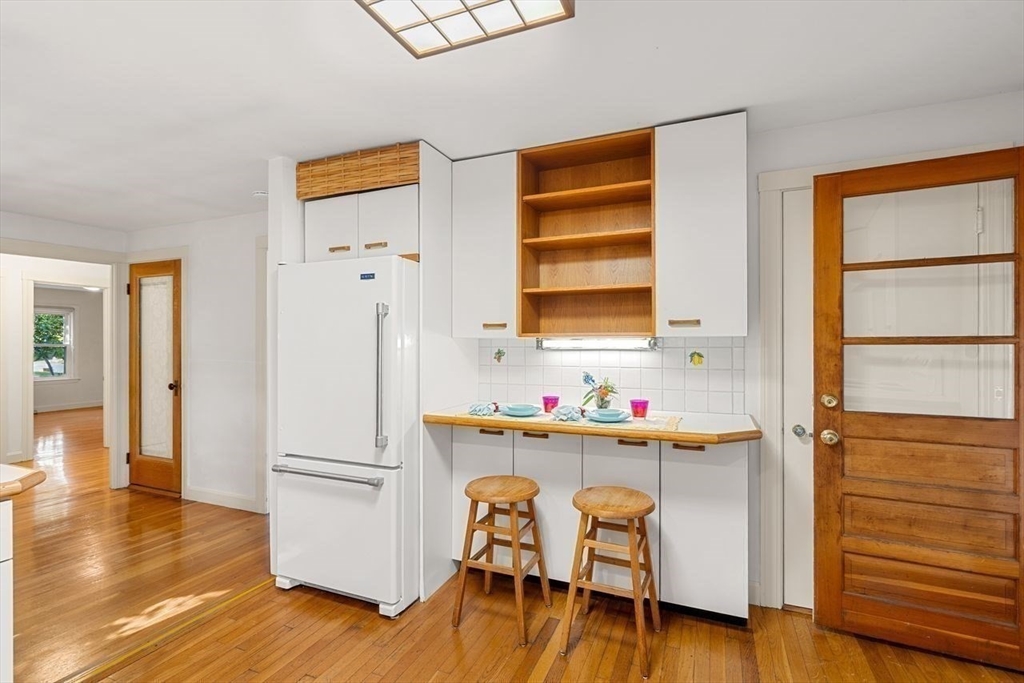 9 Pearson Street Beverly, MA 01915 - Photo 8 of 41 a view of a workspace with furniture and wooden floor