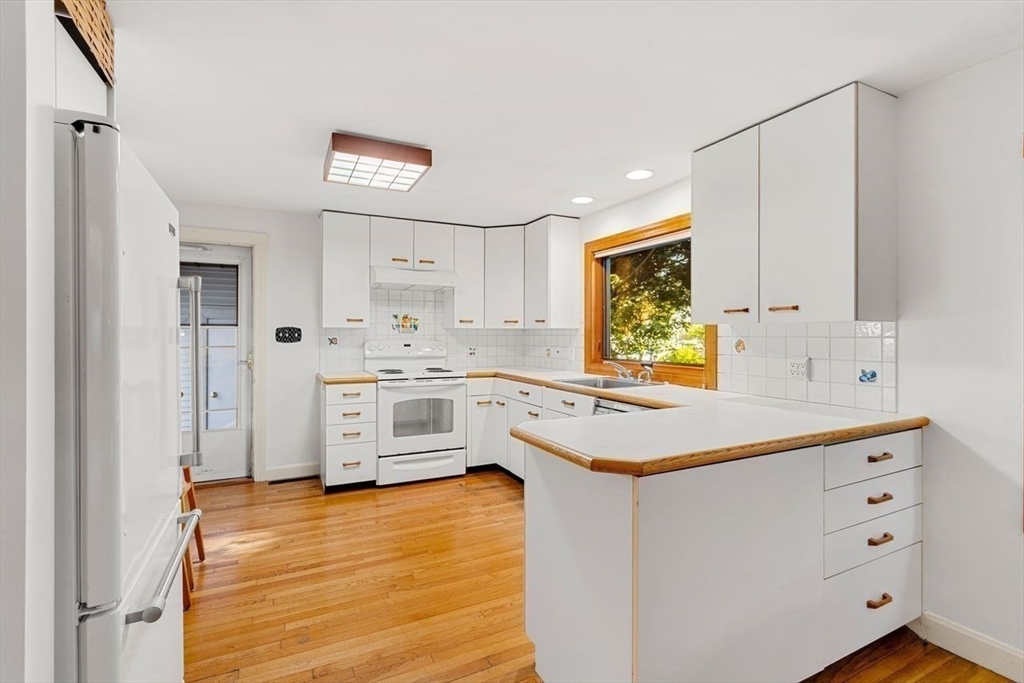 9 Pearson Street Beverly, MA 01915 - Photo 10 of 41 a kitchen with white cabinets and white appliances