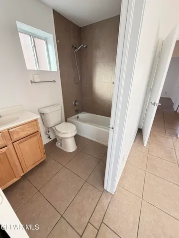 a bathroom with a sink a toilet and bathtub