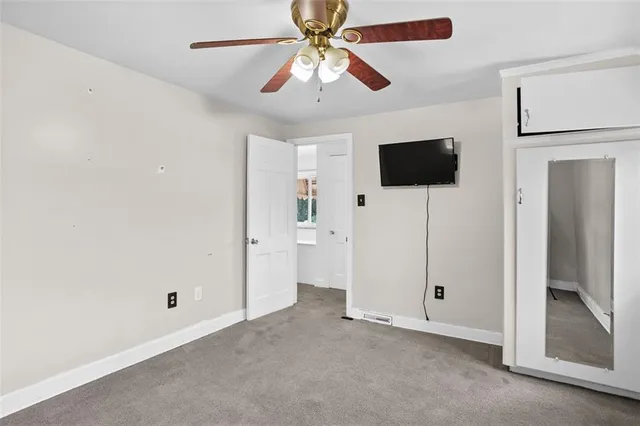 a view of a livingroom with a flat screen tv